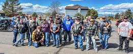 A large gathering of CBLR riders beneath a blue sky