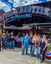 Friends gathered outside a hotel and taphouse