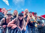Friends sharing a sunny outdoor group selfie